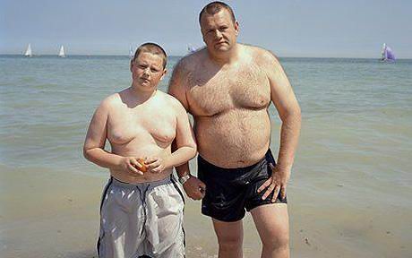 alt="obese boy with obese dad"