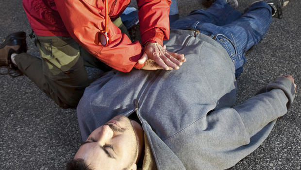 "trained volunteer performing CPR maneuvers"