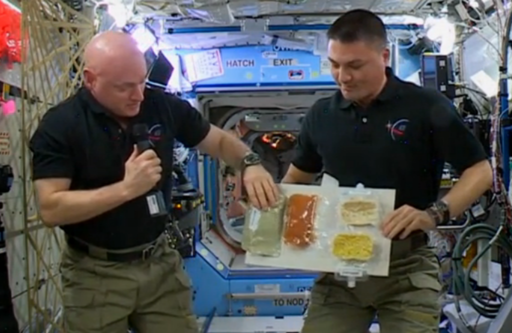 alt="American Astronauts Thanksgiving Meal on ISS"