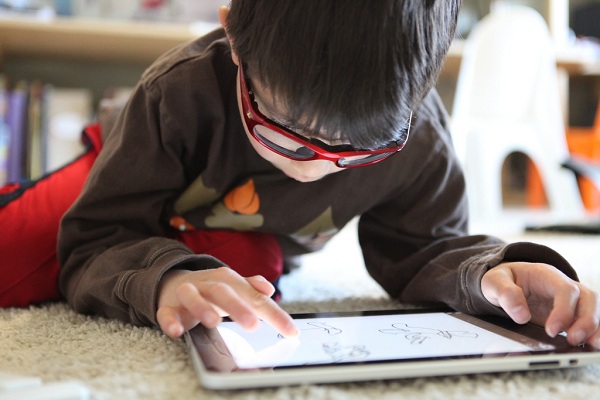 A little boy using a tablet