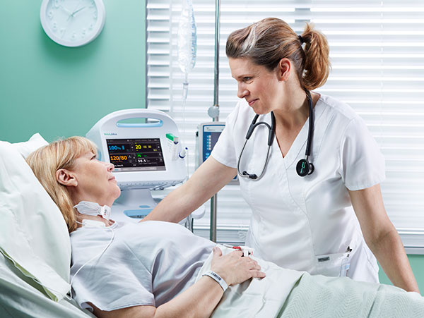 Nurse talking to sick patient