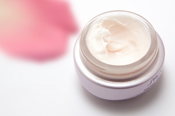 Face cream and rose petal