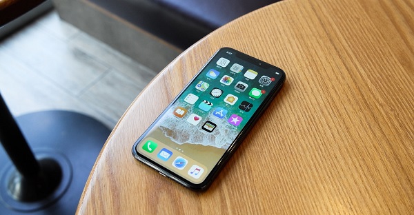 An iPhone X on a table