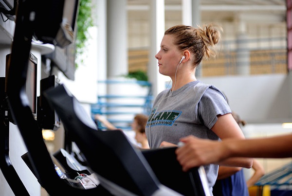 Young woman working out on the treadmill