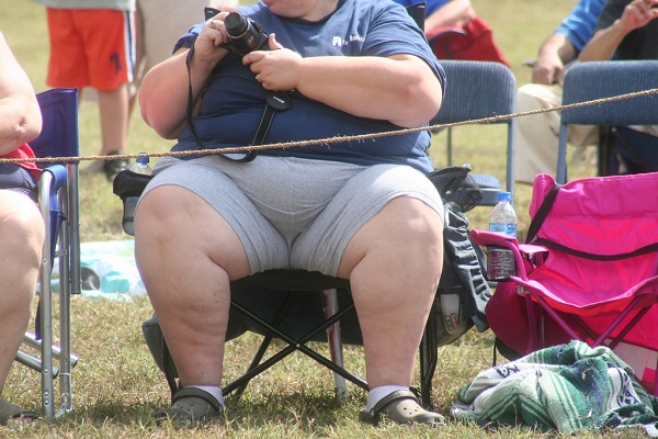 Obese lady sitting on a chair