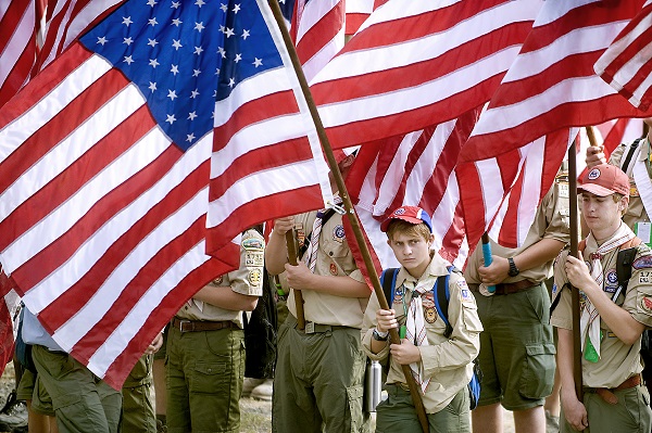 Boy scout carrying U.s. flag