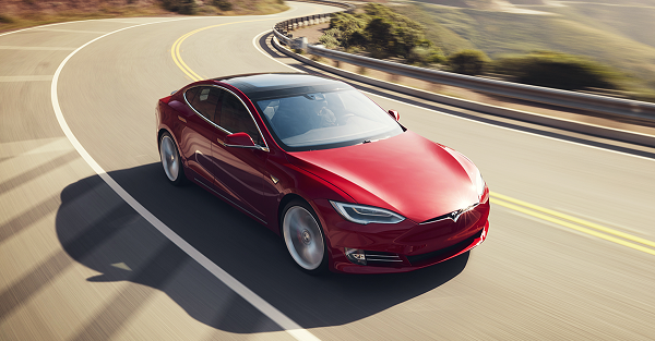 Red Tesla Model S on the road